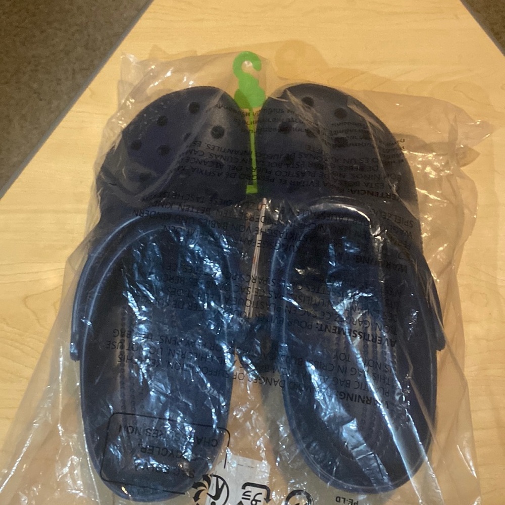 Unopened size 11 navy blue crocs